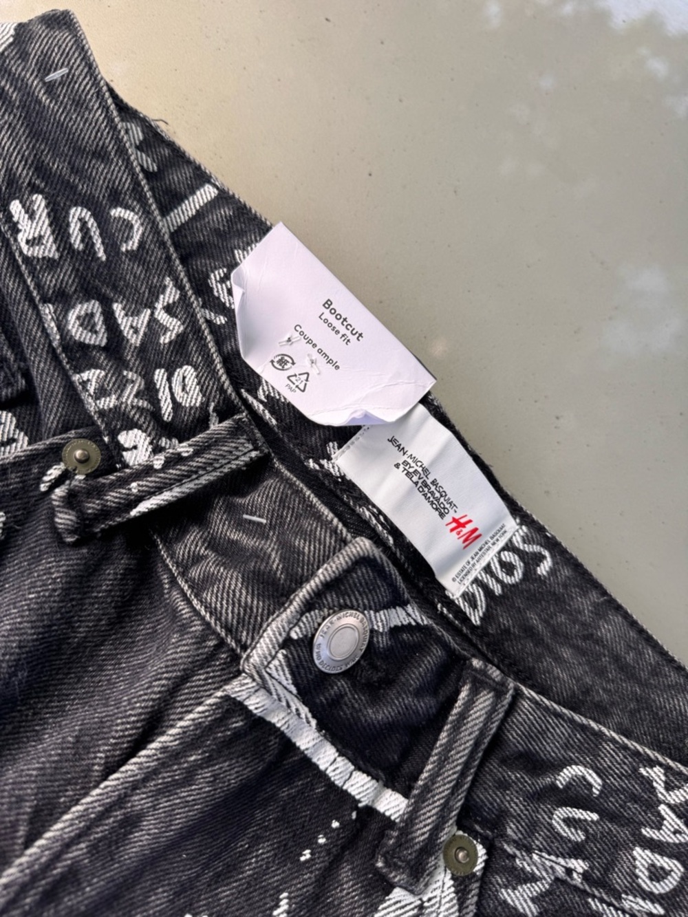 H&M wide leg jeans with art work from the late Jean M. Basquiat.